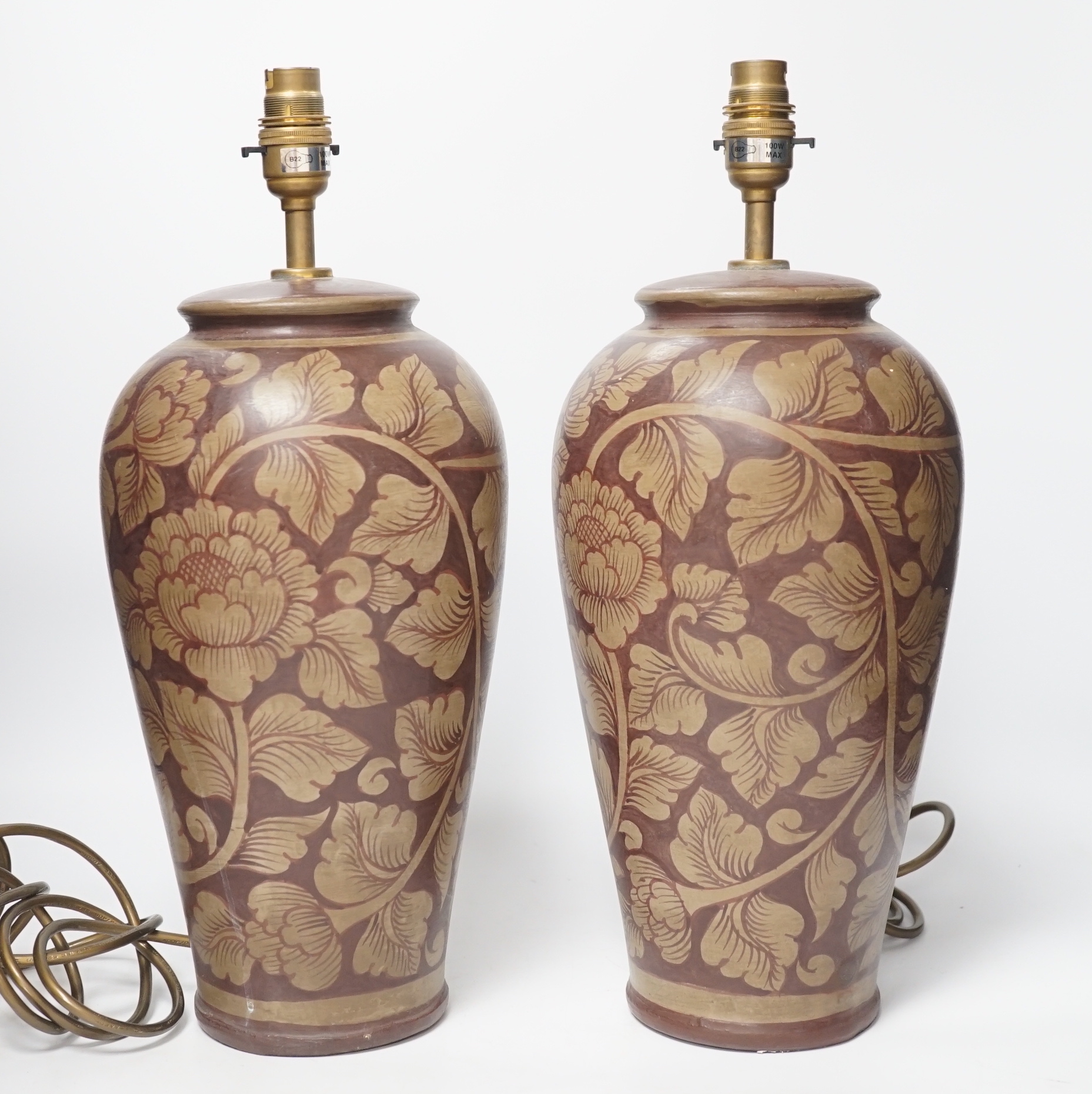 A pair of modern pottery floral designed lamps, total height 42cm